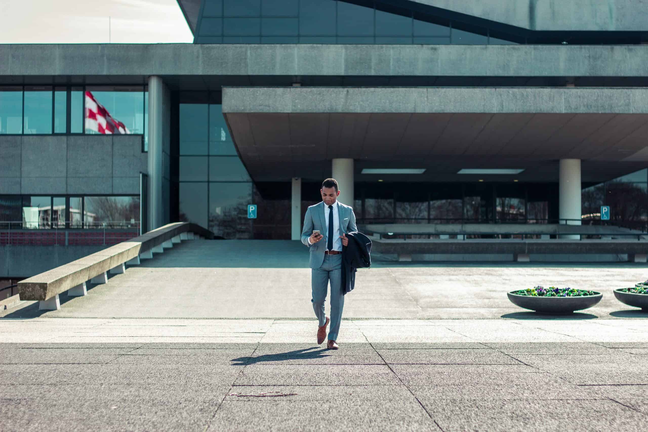 man in suit leaving building